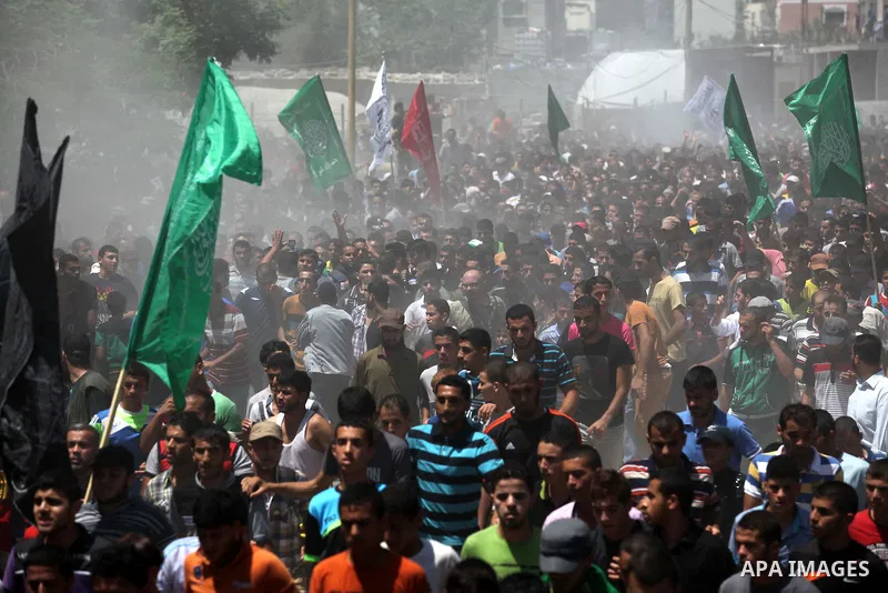Palestinians carry the bodies of three senior Hamas commanders, who were killed in an Israeli air strike, during their funeral in Rafah in the southern Gaza Strip August 21, 2014. Israel killed three senior Hamas command...