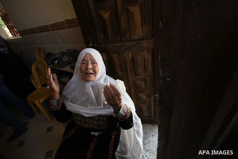 Palestinian relatives of Mohammed Abu Shammala, one of three senior Hamas commanders who were killed in an Israeli air strike, mourns during his funeral in Rafah in the southern Gaza Strip August 21, 2014. Israel killed...