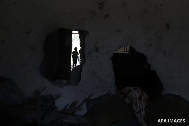 A Palestinian man inspects the remains of a house, which witnesses said was destroyed in an Israeli air strike, in Gaza City August 22, 2014. Since the collapse on Tuesday of a 10-day ceasefire, the Israeli military has...
