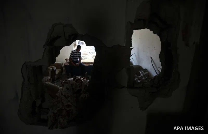 A Palestinian man inspects the remains of a house, which witnesses said was destroyed in an Israeli air strike, in Gaza City August 22, 2014. Since the collapse on Tuesday of a 10-day ceasefire, the Israeli military has...