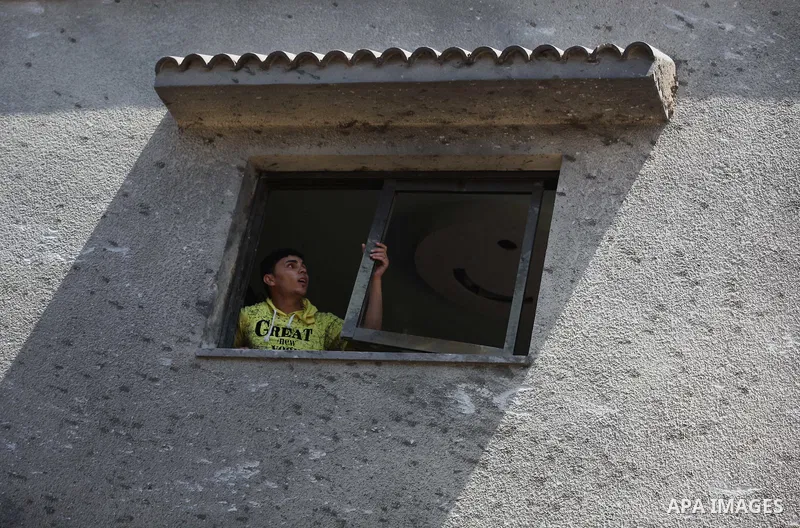 A Palestinian boy inspects the remains of a house, which witnesses said was destroyed in an Israeli air strike, in Gaza City August 22, 2014. Since the collapse on Tuesday of a 10-day ceasefire, the Israeli military has...
