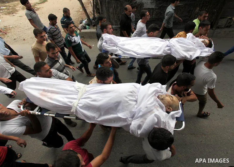 Palestinian mourners carry the bodies of their relatives from Al-abadlah families, who were killed in an Israeli air strike, during their funeral at hospital in Khan Younis in the Southern Gaza strip. Since the collapse...