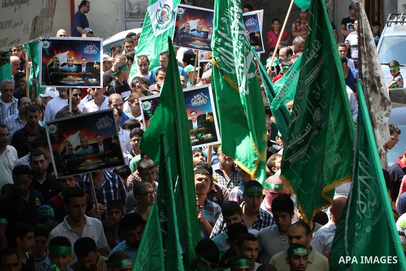 Supporters of the Palestinian Islamist Hamas movement gather during a demonstration in the West Bank city of Nablus to support people in the Gaza Strip on August 22, 2014. Four Palestinians were killed in new Israeli air...