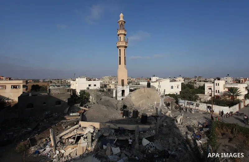 Palestinians inspect the remains of a mosque , which witnesses said was destroyed in an Israeli air strike, in Khan Younis in the southern Gaza strip August 23, 2014. Hamas-led gunmen in Gaza executed 18 Palestinians acc...