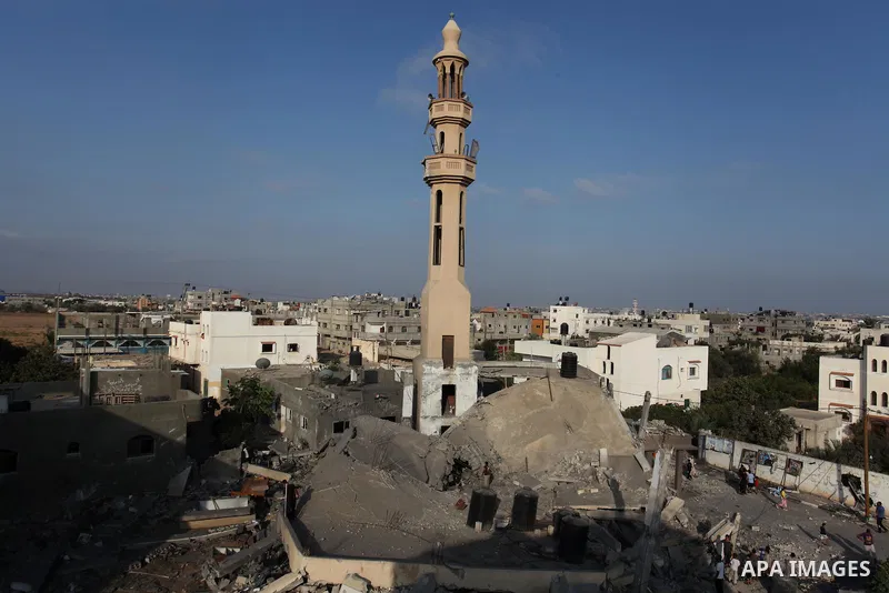 Palestinians inspect the remains of a mosque , which witnesses said was destroyed in an Israeli air strike, in Khan Younis in the southern Gaza strip August 23, 2014. Hamas-led gunmen in Gaza executed 18 Palestinians acc...