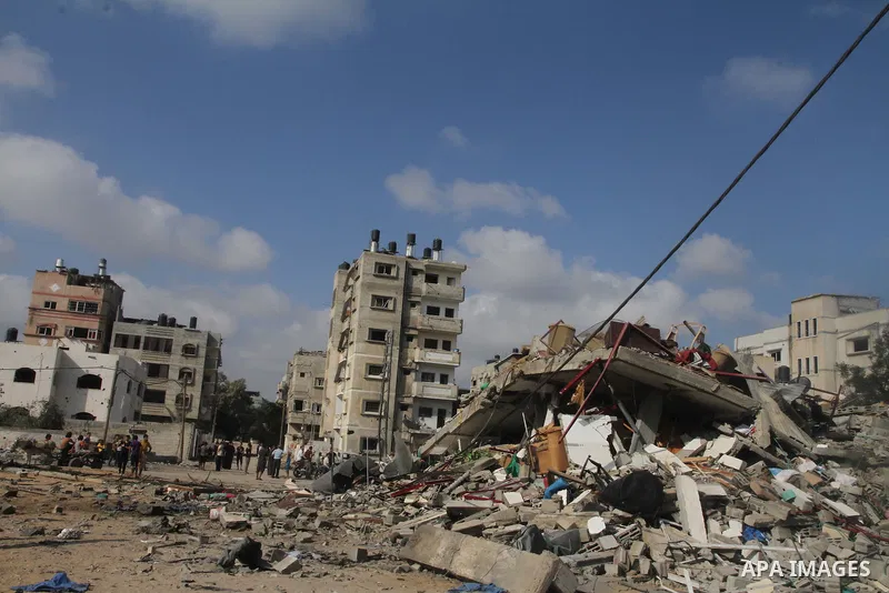 Palestinians search for their belongings amid the remains of their house, which witnesses said was destroyed in an Israeli air strike, in Gaza City August 23, 2014. Hamas-led gunmen in Gaza executed 18 Palestinians accus...