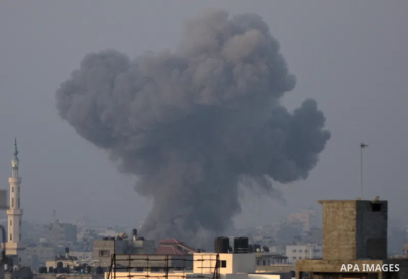 Smoke rises following an Israeli air strike in Gaza City on August 23, 2014. Hamas-led gunmen in Gaza executed 18 Palestinians accused of collaborating with Israel on Friday, accelerating a crackdown on suspected informe...