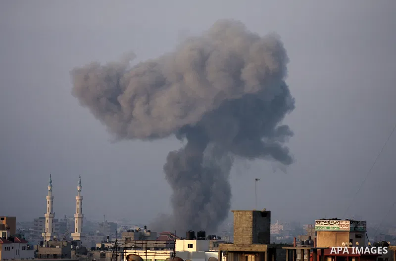 Smoke rises following an Israeli air strike in Gaza City on August 23, 2014. Hamas-led gunmen in Gaza executed 18 Palestinians accused of collaborating with Israel on Friday, accelerating a crackdown on suspected informe...