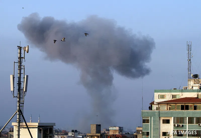 Smoke rises following an Israeli air strike in Gaza City on August 23, 2014. Hamas-led gunmen in Gaza executed 18 Palestinians accused of collaborating with Israel on Friday, accelerating a crackdown on suspected informe...