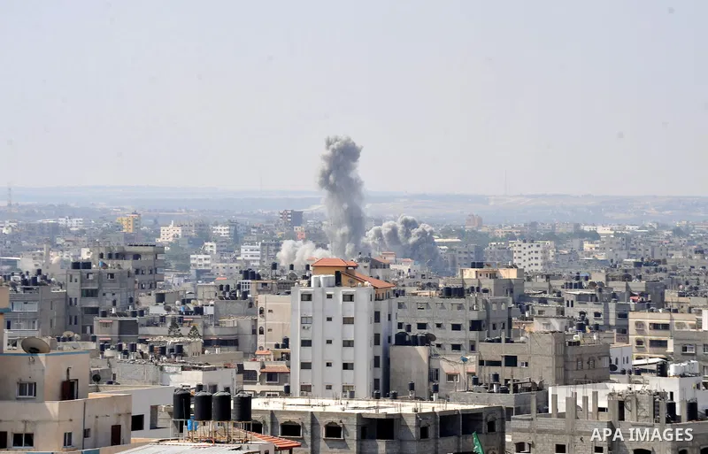 Smoke rises following an Israeli air strike on a Palestinian home in Gaza City on August 23, 2014. Israel kept up the pressure on Hamas in Gaza, carrying out multiple air strikes that killed six Palestinians, five of the...
