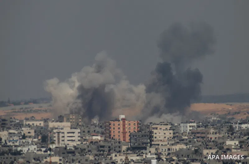 Smoke rises following an Israeli air strike on a Palestinian home in Gaza City on August 23, 2014. Israel kept up the pressure on Hamas in Gaza, carrying out multiple air strikes that killed six Palestinians, five of the...