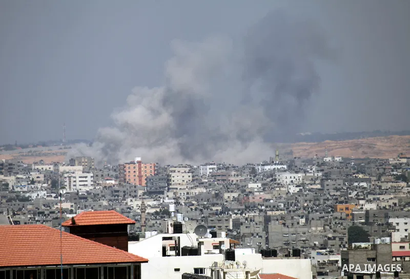 Smoke rises following an Israeli air strike on a Palestinian home in Gaza City on August 23, 2014. Israel kept up the pressure on Hamas in Gaza, carrying out multiple air strikes that killed six Palestinians, five of the...