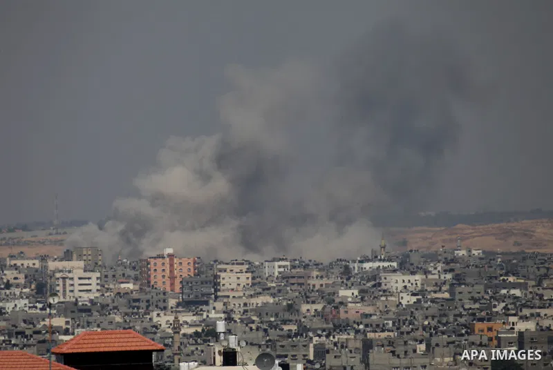 Smoke rises following an Israeli air strike on a Palestinian home in Gaza City on August 23, 2014. Israel kept up the pressure on Hamas in Gaza, carrying out multiple air strikes that killed six Palestinians, five of the...