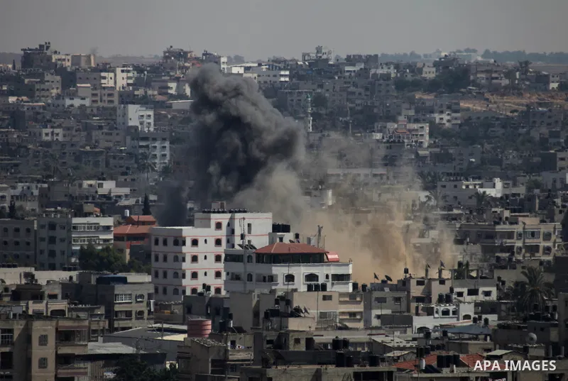 Smoke rises following an Israeli air strike on a Palestinian home in Gaza City on August 23, 2014. Israel kept up the pressure on Hamas in Gaza, carrying out multiple air strikes that killed six Palestinians, five of the...