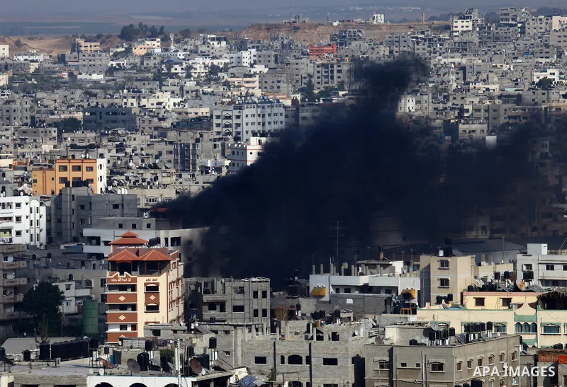 Smoke rises following an Israeli air strike on a Palestinian home in Gaza City on August 23, 2014. Israel kept up the pressure on Hamas in Gaza, carrying out multiple air strikes that killed six Palestinians, five of the...