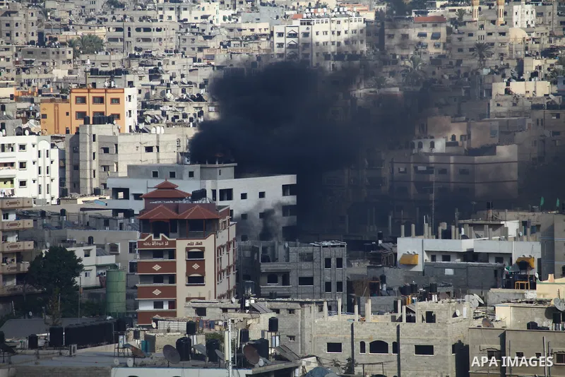 Smoke rises following an Israeli air strike on a Palestinian home in Gaza City on August 23, 2014. Israel kept up the pressure on Hamas in Gaza, carrying out multiple air strikes that killed six Palestinians, five of the...