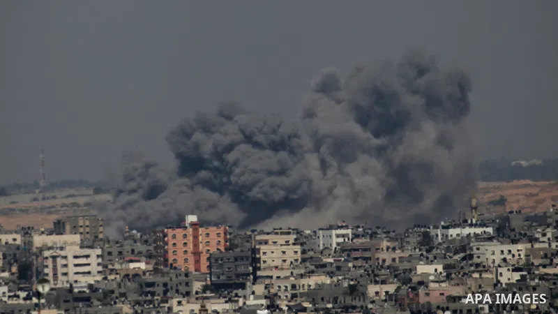 Smoke rises following an Israeli air strike on a Palestinian home in Gaza City on August 23, 2014. Israel kept up the pressure on Hamas in Gaza, carrying out multiple air strikes that killed six Palestinians, five of the...