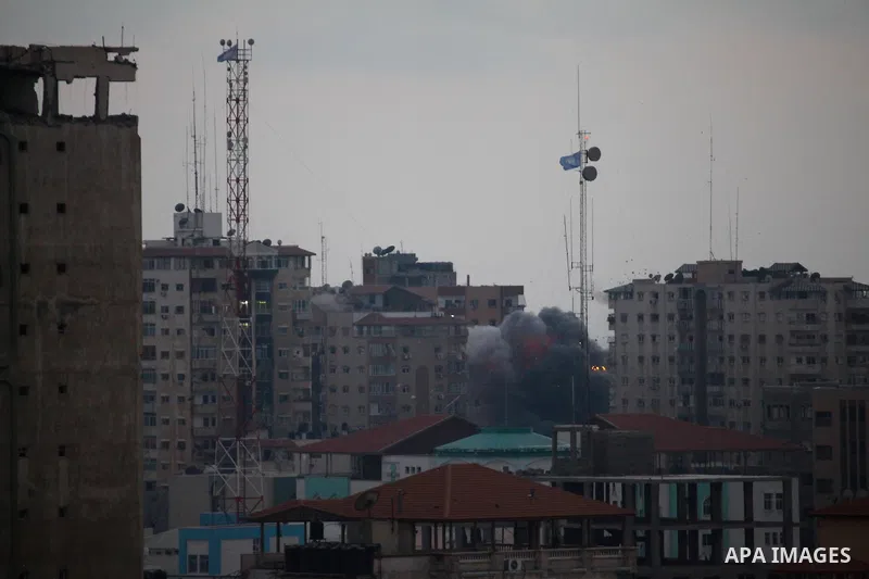 A ball of fire rises from an explosion on al-Zafer apartment tower following an Israeli air strike in Gaza City, in the northern Gaza Strip, Saturday, Aug. 23, 2014. Israeli aircraft fired two missiles at a 12-story apar...