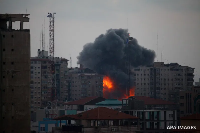 A ball of fire rises from an explosion on al-Zafer apartment tower following an Israeli air strike in Gaza City, in the northern Gaza Strip, Saturday, Aug. 23, 2014. Israeli aircraft fired two missiles at a 12-story apar...