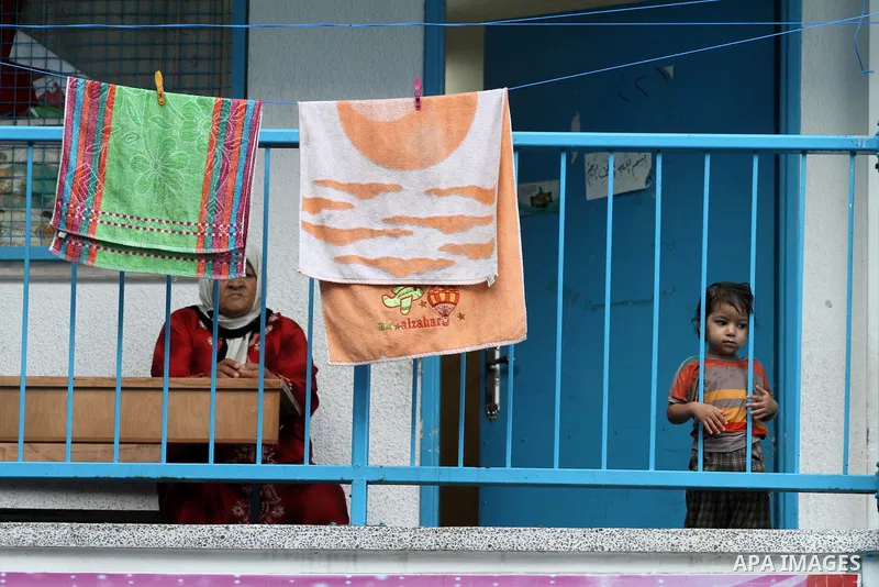 Palestinian displaced sit at a UN school in Gaza City on August 24, 2014. Egypt called on Israel and the Palestinians on Saturday to halt hostilities and resume peace talks, but both sides kept up attacks, including the...