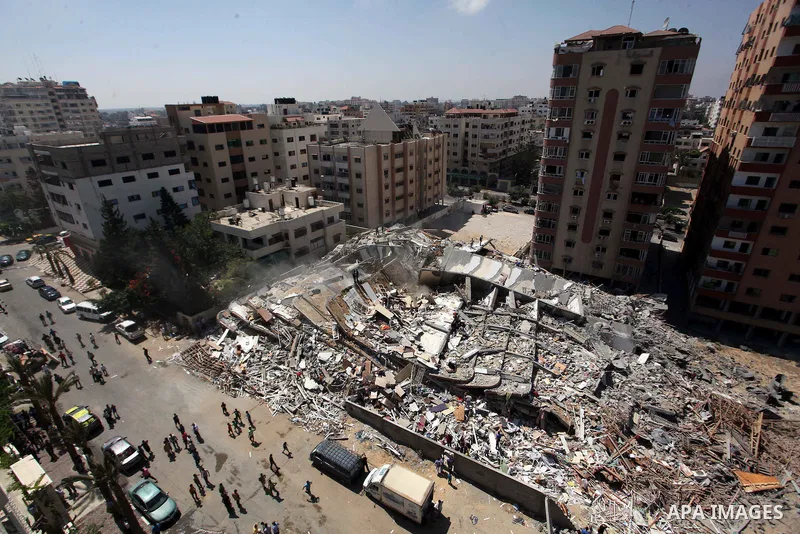 A general view of the rubble of a residential tower, which witnesses said was destroyed in an Israeli air strike, is seen in Gaza City August 24, 2014. Egypt called on Israel and the Palestinians on Saturday to halt host...