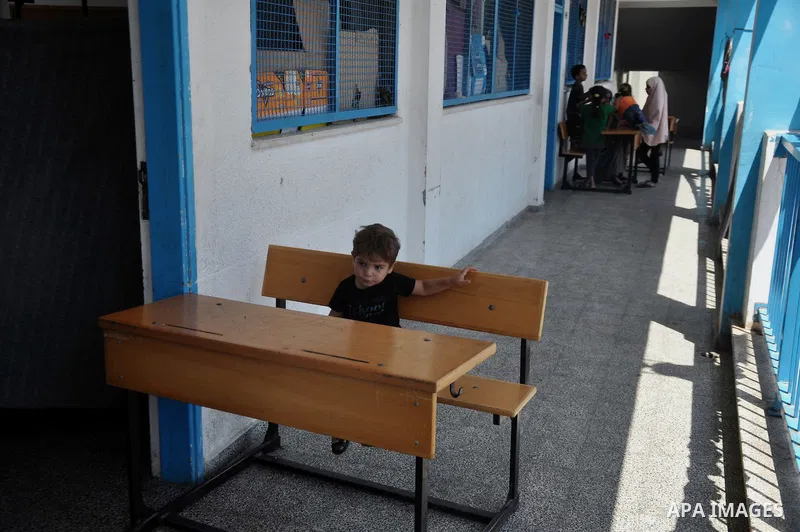Palestinian displaced children sit at a UN school in Gaza City on August 24, 2014. The UN recently said that 460,000 Palestinians have been displaced by the violence which is more than a quarter of the population of the...