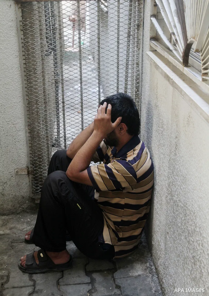 A Palestinian relative mourns on the body of of Palestinian Osama Shabbir, whom medics said was killed in an Israeli air strike, during his funeral in Jabaliya in the northern Gaza Strip August 25, 2014. Israel's Prime M...