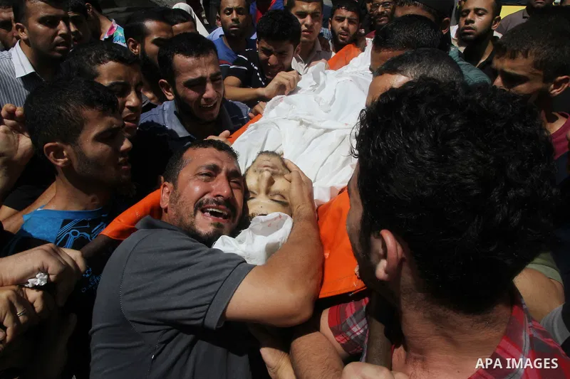 The father of Palestinian Osama Shabbir mourns during his funeral in Jabaliya in the northern Gaza Strip August 25, 2014. Israel's Prime Minister Benjamin Netanyahu warned Palestinian civilians on Sunday to leave immedia...
