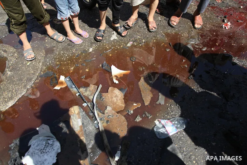 Palestinians surround a blood of Palestinians which witnesses said was hit by an Israeli air strike, in Gaza City August 25, 2014. Israeli air strikes killed at least five Palestinians in the Gaza Strip and militants kep...