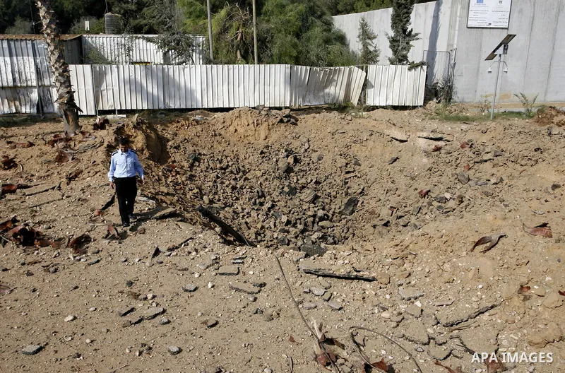 A member of the Palestinian security forces inspects the damage from an Israeli air strike at the Rafah border crossing with Egypt in the southern Gaza Strip on August 25, 2014. Violence reverberated across Gaza with fou...
