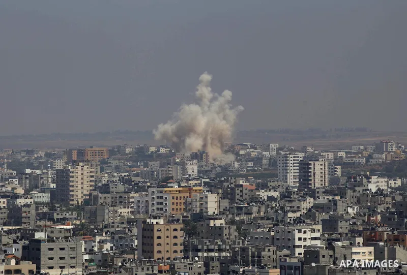 Smoke and dust rise after an Israeli strike hits Gaza City, northern Gaza Strip, Monday, Aug. 25, 2014. Photo by Mohammed Othman