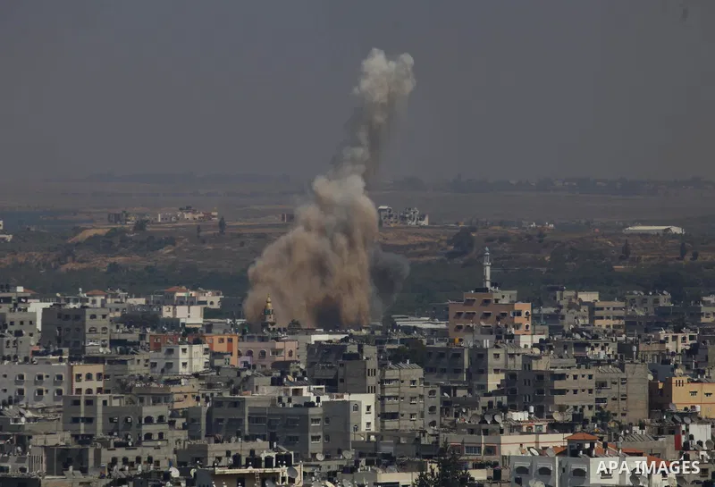 Smoke and dust rise after an Israeli strike hits Gaza City, northern Gaza Strip, Monday, Aug. 25, 2014. Photo by Mohammed Othman