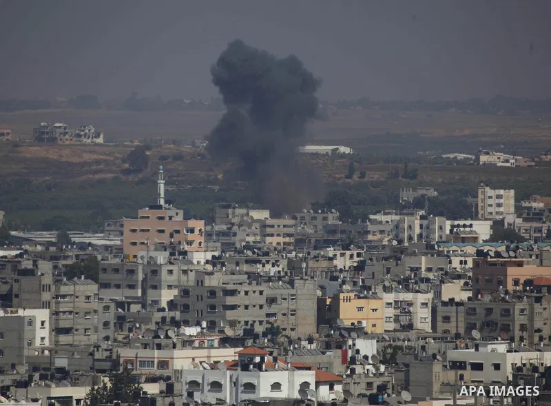 Smoke and dust rise after an Israeli strike hits Gaza City, northern Gaza Strip, Monday, Aug. 25, 2014. Photo by Mohammed Othman