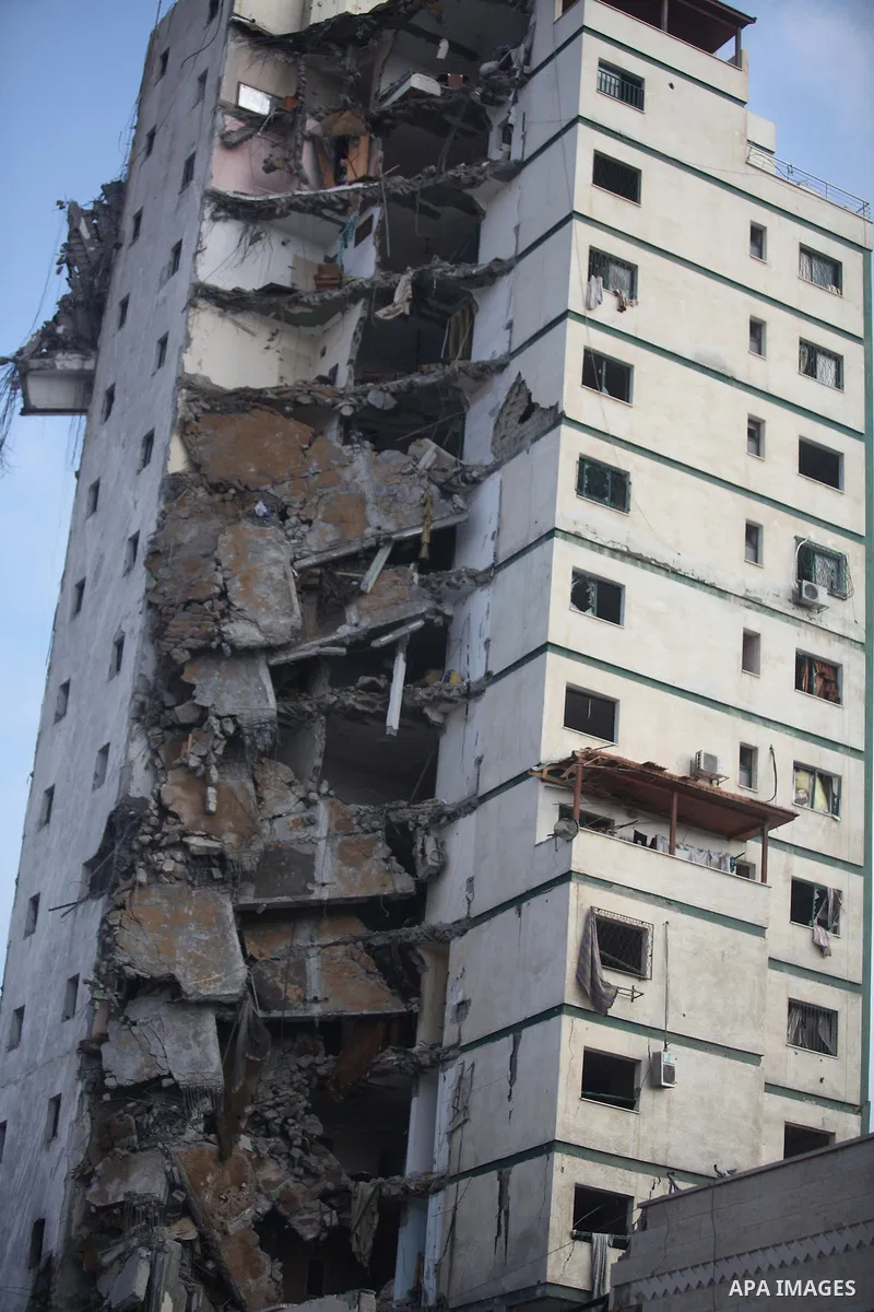 A general view of the remains of one of Gaza's tallest apartment towers, which witnesses said was hit by an Israeli air strike that destroyed much of it, in Gaza City August 26, 2014. Israeli air strikes launched before...