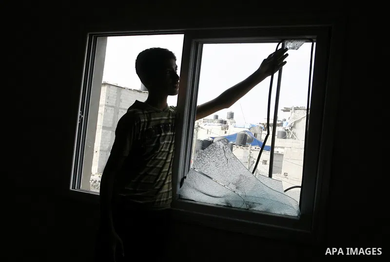 A Palestinian boy inspects the remains of his homes that was destroyed by an Israeli air strike on August 26, 2014. Israeli fire killed 10 Palestinians across Gaza on August 25, while Egypt proposed a new ceasefire that...