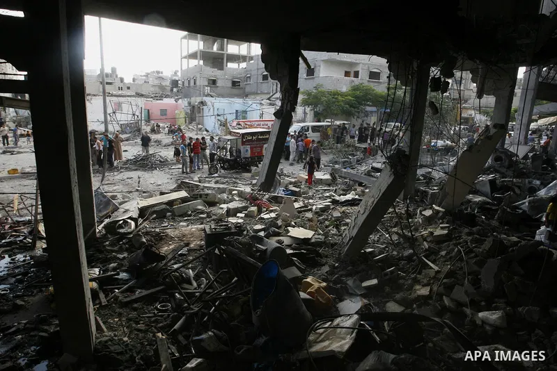 Palestinian residents salvage items from the remains of their homes that were destroyed by an Israeli air strike on Rafah town in the southern Gaza Strip on August 26, 2014. Israeli fire killed 10 Palestinians across Gaz...