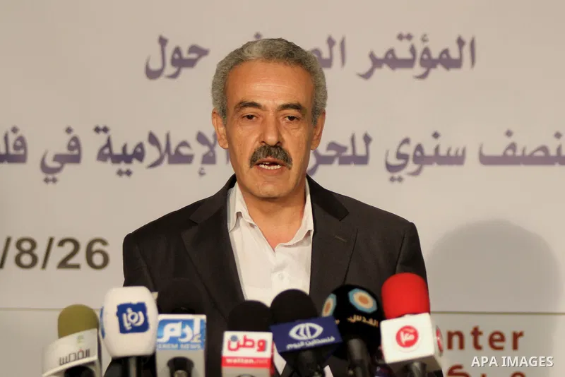 Palestinian director of the Center Mada for Media Freedom, Musa Rimawi speaks during a press conference about violations by Israeli and Palestinian to journalists, in the West Bank city of Ramallah, on Aug. 26, 2014. Pho...