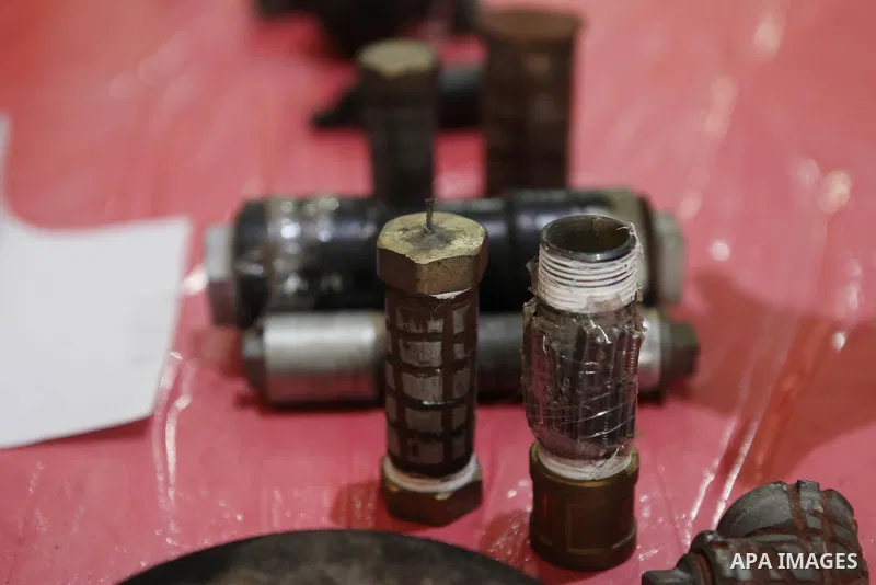 Palestinians attend the opening of gallery contains Israeli damaged equipment, in the West Bank city of Ramallah, on Aug. 26, 2014. Israeli air strikes launched before dawn on Tuesday killed two Palestinians and destroye...