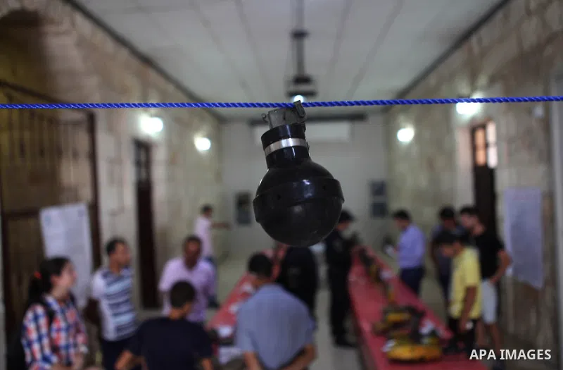 Palestinians attend the opening of gallery contains Israeli damaged equipment, in the West Bank city of Ramallah, on Aug. 26, 2014. Israeli air strikes launched before dawn on Tuesday killed two Palestinians and destroye...