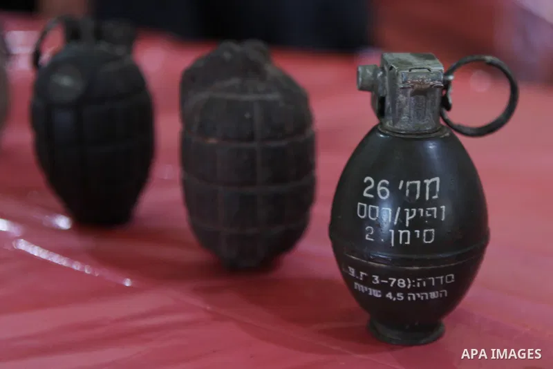 Palestinians attend the opening of gallery contains Israeli damaged equipment, in the West Bank city of Ramallah, on Aug. 26, 2014. Israeli air strikes launched before dawn on Tuesday killed two Palestinians and destroye...