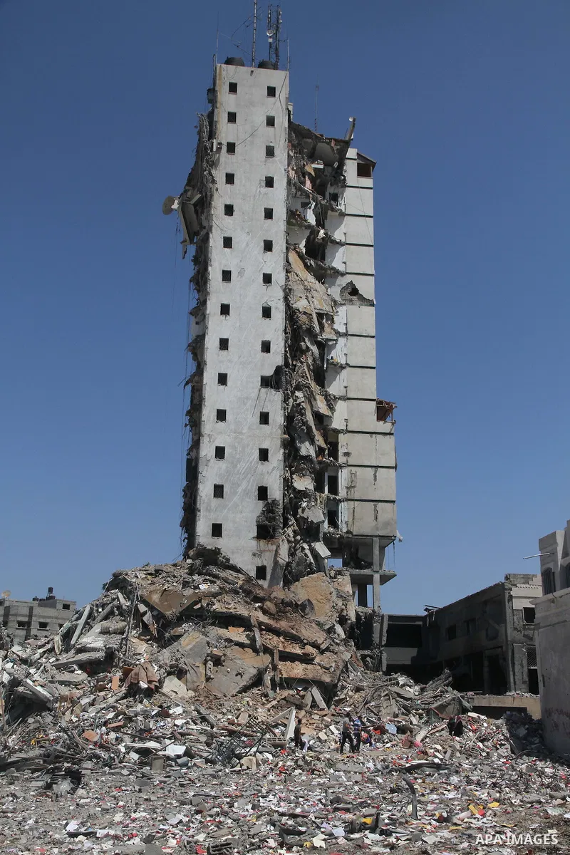 A general view of the remains of one of Gaza's tallest apartment towers, which witnesses said was hit by an Israeli air strike that destroyed much of it, in Gaza City August 26, 2014. Israeli air strikes launched before...