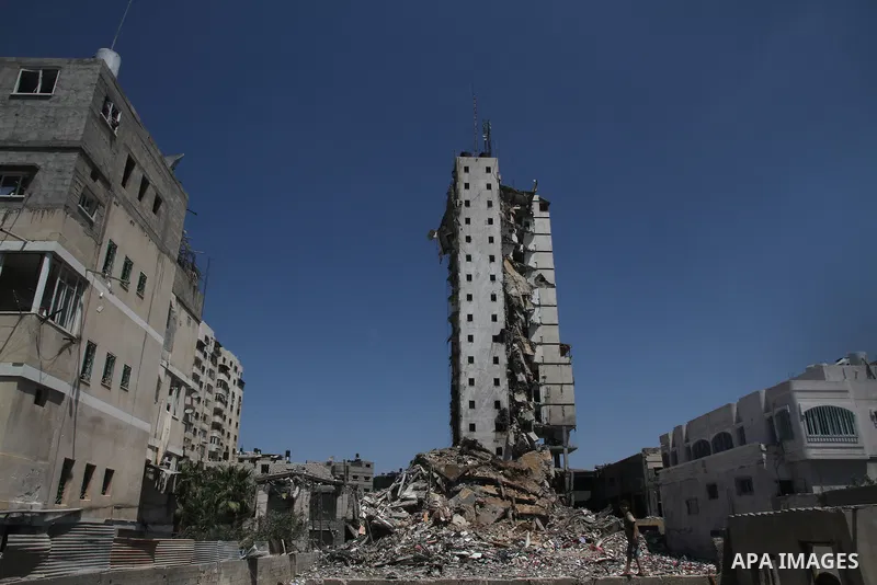 A general view of the remains of one of Gaza's tallest apartment towers, which witnesses said was hit by an Israeli air strike that destroyed much of it, in Gaza City August 26, 2014. Israeli air strikes launched before...