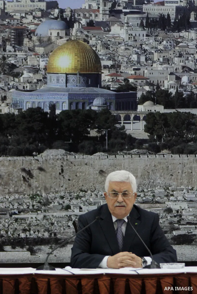 Palestinian President Mahmoud Abbas delivers a speech during a special leadership meeting in the West Bank city of Ramallah, 26 August 2014. Palestinian militant groups in the Gaza Strip and Israel have reached a deal to...
