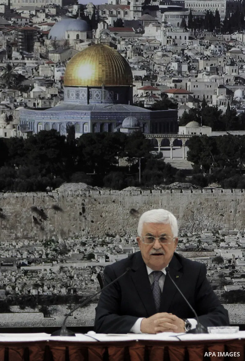 Palestinian President Mahmoud Abbas delivers a speech during a special leadership meeting in the West Bank city of Ramallah, 26 August 2014. Palestinian militant groups in the Gaza Strip and Israel have reached a deal to...