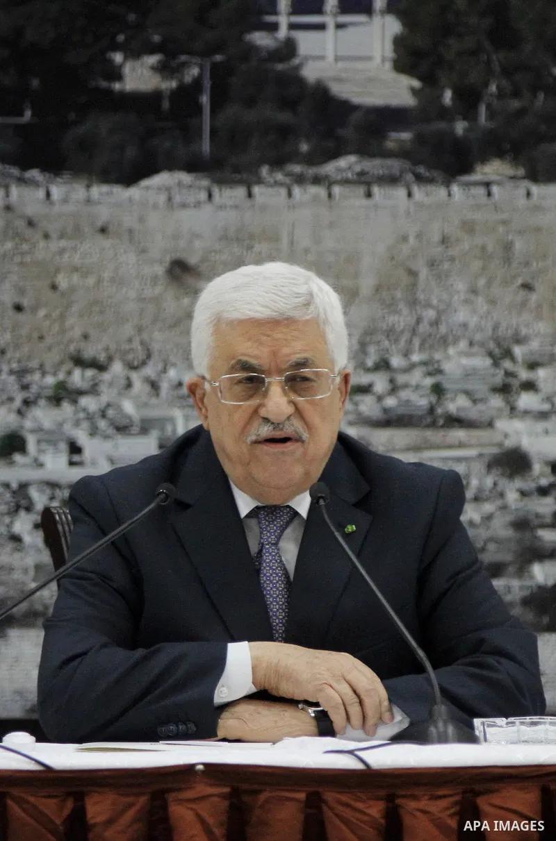 Palestinian President Mahmoud Abbas delivers a speech during a special leadership meeting in the West Bank city of Ramallah, 26 August 2014. Palestinian militant groups in the Gaza Strip and Israel have reached a deal to...