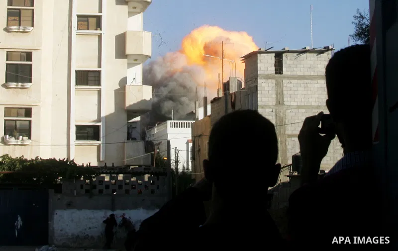Flames are seen during what witnesses said was an Israeli air strike that targeted the house of Palestinian senior Islamic Jihad leader Nafez Azzam in Rafah, in the southern Gaza Strip August 26, 2014. A Gaza ceasefire b...