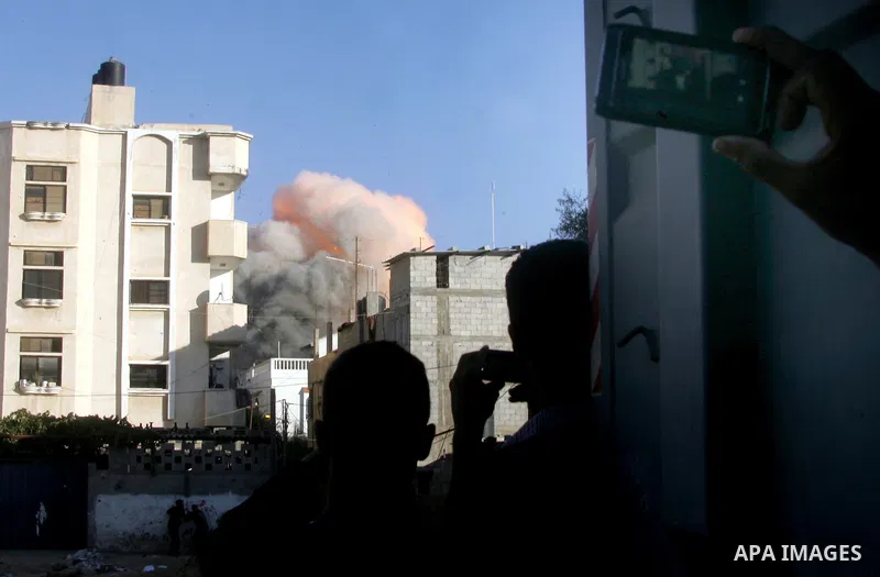 Flames are seen during what witnesses said was an Israeli air strike that targeted the house of Palestinian senior Islamic Jihad leader Nafez Azzam in Rafah, in the southern Gaza Strip August 26, 2014. A Gaza ceasefire b...