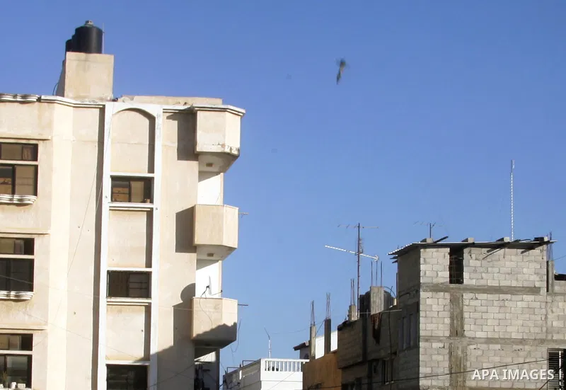 A missile which witnesses said was fired by an Israeli aircraft is seen as it targets the house of Palestinian senior Islamic Jihad leader Nafez Azzam in Rafah, in the southern Gaza Strip August 26, 2014. A Gaza ceasefir...