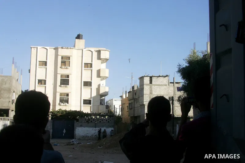 A missile which witnesses said was fired by an Israeli aircraft is seen as it targets the house of Palestinian senior Islamic Jihad leader Nafez Azzam in Rafah, in the southern Gaza Strip August 26, 2014. A Gaza ceasefir...