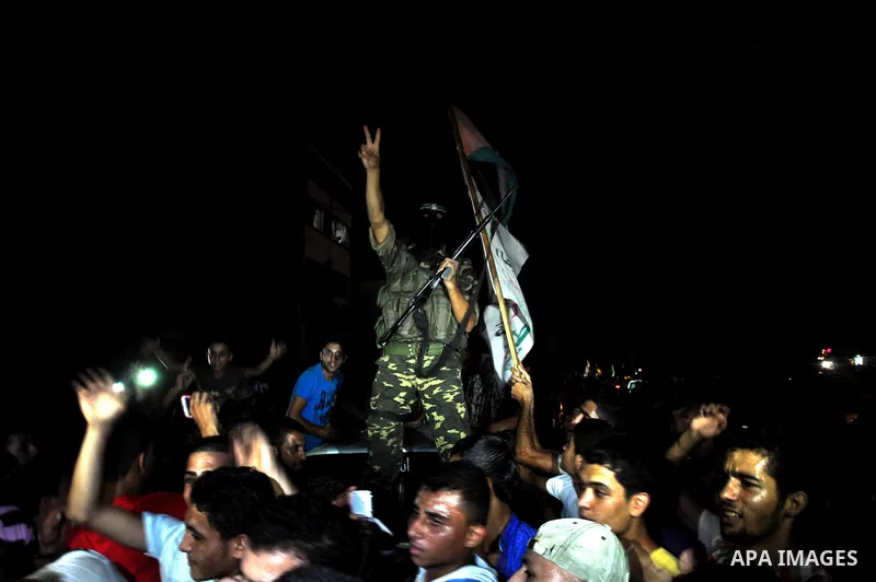 Palestinians gather in the streets celebrating a ceasefire in Gaza City, 26 August 2014. Palestinian President Mahmoud Abbas announced on 26 August 2014 an Egyptian-brokered ceasefire proposal to end seven weeks of fight...